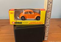 Orange Corgi Volkswagen Beetle #383 in original window box beside ruler