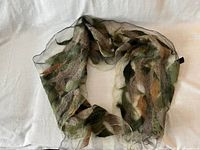 Scarf coiled to show felted wool patches and sheer silk sections