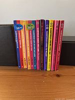 Eight Garfield paperbacks upright showing spines