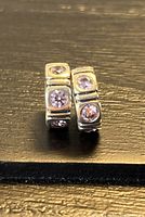 Front view of both spacer charms showing zirconia stones