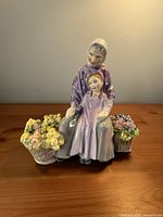 Front view of Royal Doulton Granny's Heritage figurine with flower baskets