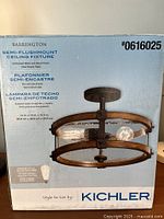 Front of sealed Kichler Barrington fixture box showing product image and model