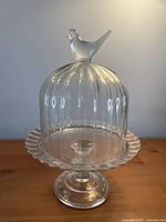 Cake stand assembled with dome and bird finial