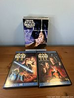 Front view of Star Wars Trilogy slipcover with Episodes II and III DVDs
