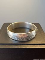 Bracelet closed showing engraved exterior design