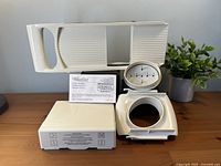 Mandoline frame, food holder, storage box and manual