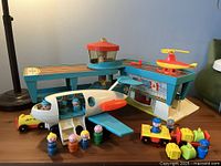 overall view of airport playset, plane, helicopter, vehicles, figures