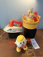 Group shot of all three Fisher-Price toys