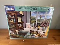 Front of shrink-wrapped puzzle box showing title, artwork, piece count