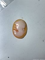 front view cameo showing female profile relief