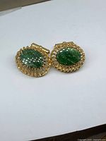 Pair of cufflinks front angled view showing stones and setting