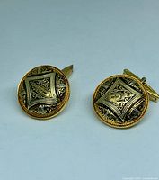 front view of both cufflinks showing damascene pattern