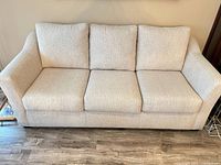 Front view showing full sofa with three cushions