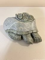 Oblique view showing turtle form and stone texture