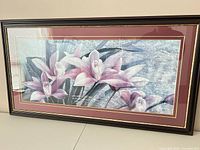 Front view of framed floral print showing image, mat, glass, frame