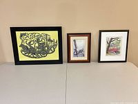 All three framed prints side by side showing front views