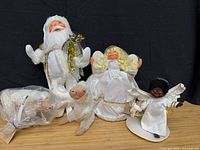 Group shot of Santa, two angels, two lambs