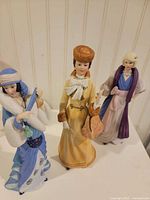 Three Lenox female figurines standing