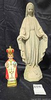 Virgin Mary statue and Infant Jesus figurine together