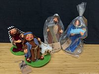 Four Annalee Nativity figures including two shepherds, Joseph plaque, Mary with Baby Jesus