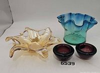 Overall view of four art glass bowls