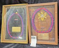 Both framed plaques side by side