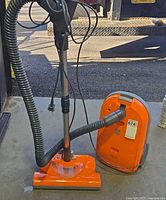 Kenmore orange canister vacuum with hose and powered head
