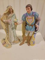 Front view of both Lenox Rapunzel and Prince figurines