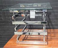 Front view showing chrome frame and glass top