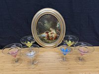 Full lot showing oval framed print and six margarita glasses