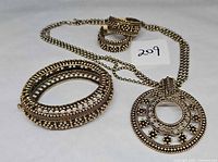 Entire set showing necklace, pendant, bangle, earrings