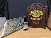 All three items: Miller sign panel, Desmond Duff dartboard cabinet, Little Chief slot machine
