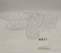 Front view of pitcher, flared bowl, footed bowl