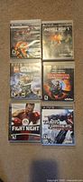 All six PS3 game cases laid out