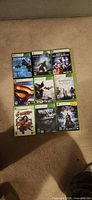 All nine Xbox 360 game cases arranged in three-by-three grid