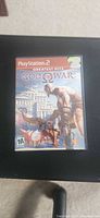 Front cover of God of War Greatest Hits PS2 game