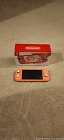Nintendo Switch Lite console front with retail box