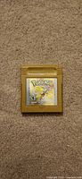 Front view of Pokémon Gold Game Boy Color cartridge showing label and color