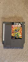 Front view of NES cartridge showing TMNT II label