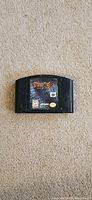 Front view of Turok 2 cartridge on carpet