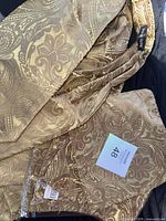 Ascot tie and pocket square set in gold paisley fabric with packaging