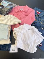 Group view showing jackets, bodysuit, hat and sleepers