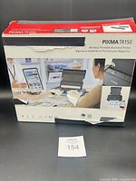 Factory box front showing model PIXMA TR150