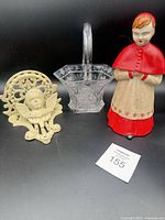 Group shot showing all three items: metal shelf, glass basket, ceramic decanter