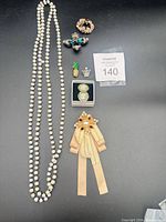 Entire lot layout showing all seven jewellery pieces