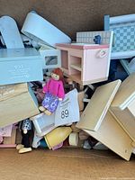 Box containing assorted wooden dollhouse furniture pieces and female doll