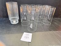 Group view showing nine smooth cylinders and one fluted cylinder