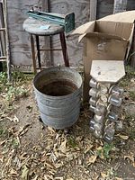 Group view: galvanized bucket on dolly, hardware organizer, stool with heat sealer on top