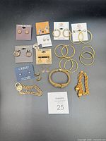 Full lot overview showing all earrings and bracelets