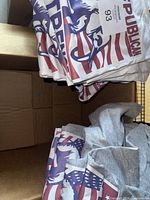 Stack of white and grey Republican Strength T-shirts